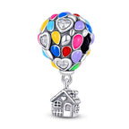 Colorful heart-shaped charm with a house pendant on a white background