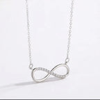 Silver infinity necklace on a WHITE BACKGROUND