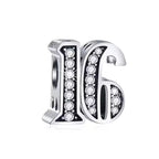 Silver earrings with '16' design and clear gemstones on a white background