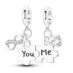 Silver puzzle piece earrings with 'You' and 'Me' text on a white background