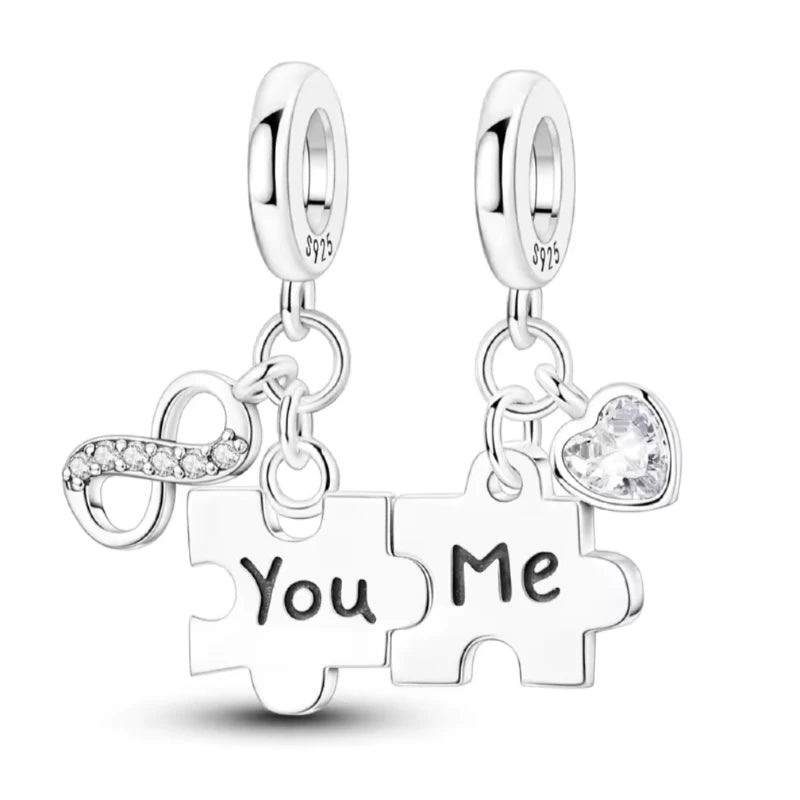 Silver puzzle piece earrings with 'You' and 'Me' text on a white background